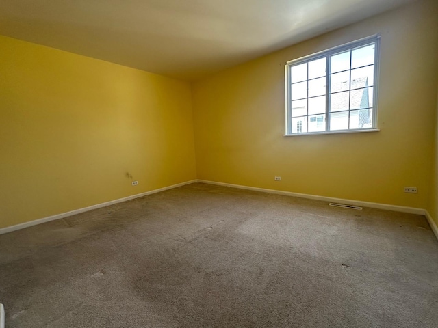 414 E Victoria Cir Unit 414, North Aurora, IL 60542 - unfurnished room featuring carpet floors, baseboards, and visible vents