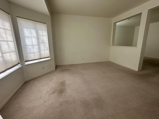 414 E Victoria Cir Unit 414, North Aurora, IL 60542 - carpeted spare room featuring baseboards