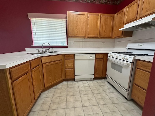 414 E Victoria Cir Unit 414, North Aurora, IL 60542 - kitchen featuring brown cabinetry, a sink, light countertops, under cabinet range hood, and white appliances