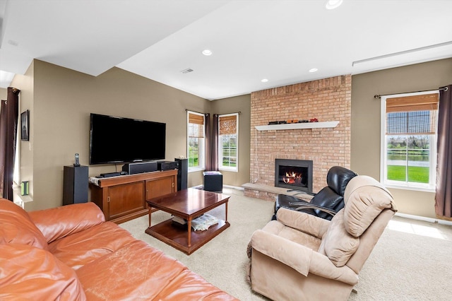living area with recessed lighting, a brick fireplace, visible vents, light carpet, and baseboards