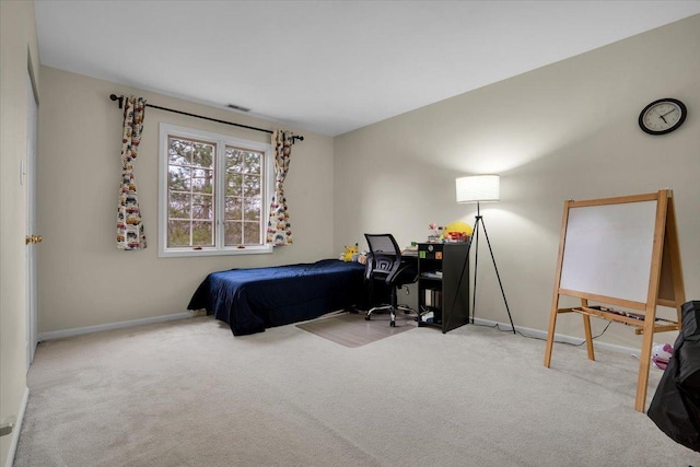 carpeted bedroom with baseboards and visible vents