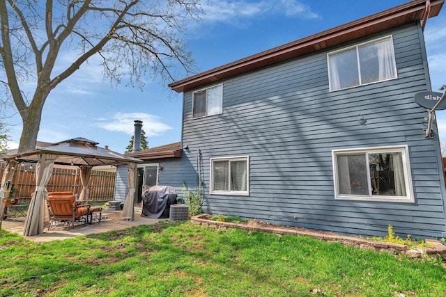 1 Red Wing Ct, Woodridge, IL 60517 - back of house featuring a yard, fence, a gazebo, a patio, and central AC