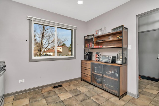 1 Red Wing Ct, Woodridge, IL 60517 - interior space featuring a toaster, visible vents, open shelves, and baseboards