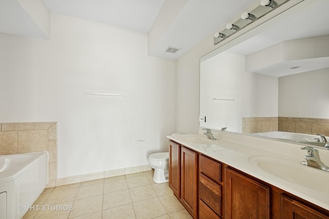 3501 Wellington Ct Unit 410, Rolling Meadows, IL 60008 - full bath featuring a garden tub, double vanity, and tile patterned floors