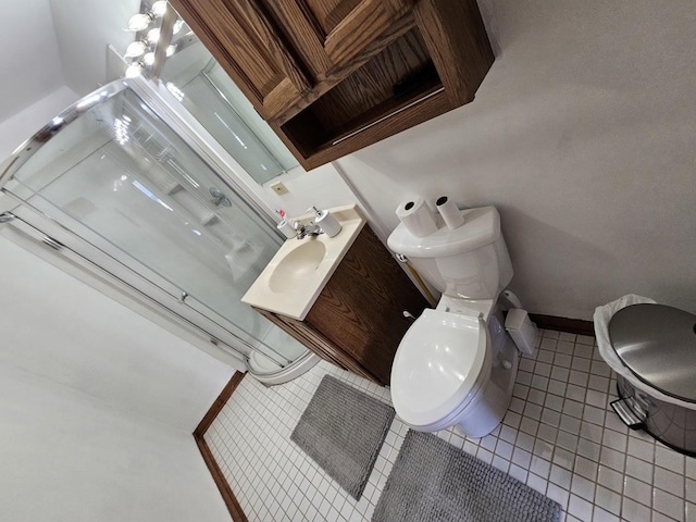 bathroom with tile patterned floors, toilet, and vanity