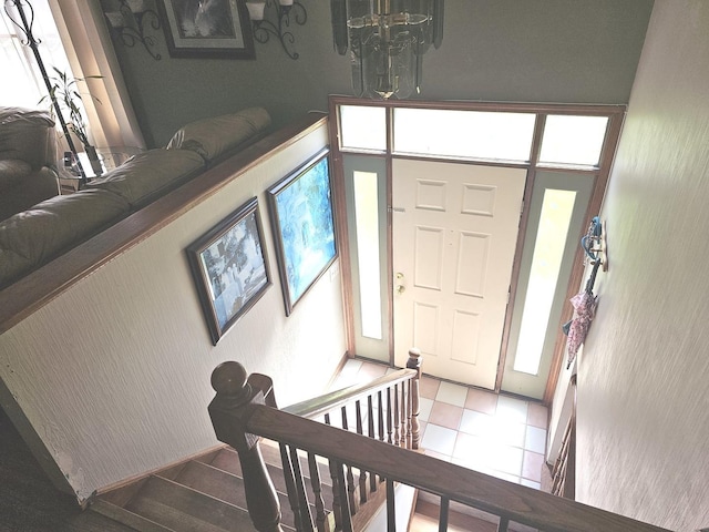 entrance foyer featuring a chandelier