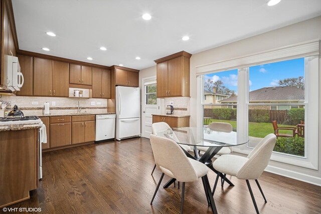dining area with recessed lighting and dark wood finished floors