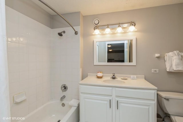 full bath featuring shower / tub combination, vanity, and toilet