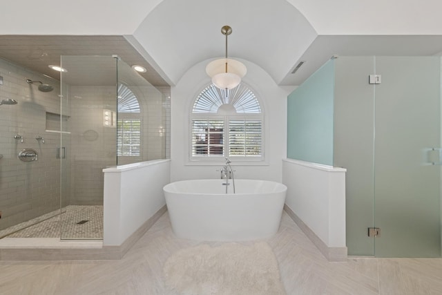 2215 N Lakewood Ave, Chicago, IL 60614 - full bathroom featuring visible vents, a shower stall, a freestanding bath, and baseboards