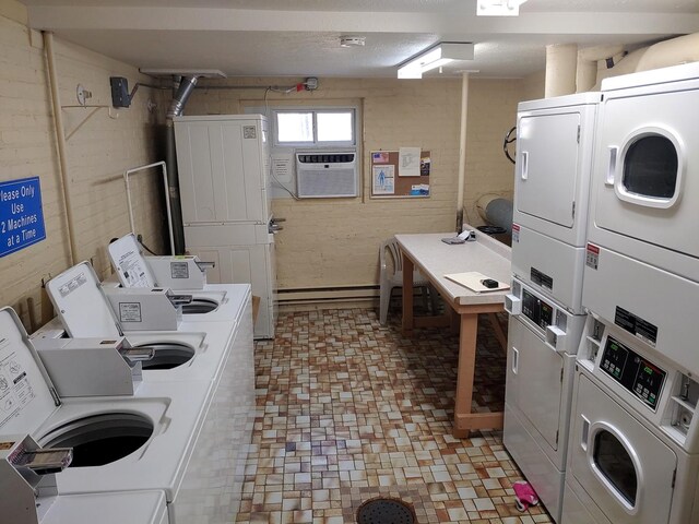 shared laundry area featuring stacked washer / dryer