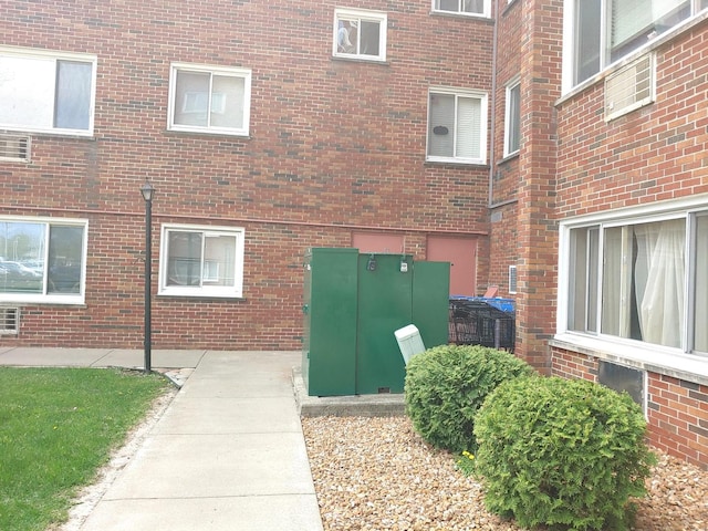 exterior space featuring brick siding