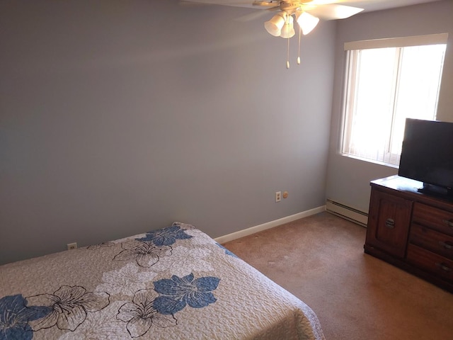 bedroom featuring ceiling fan, baseboard heating, light colored carpet, and baseboards