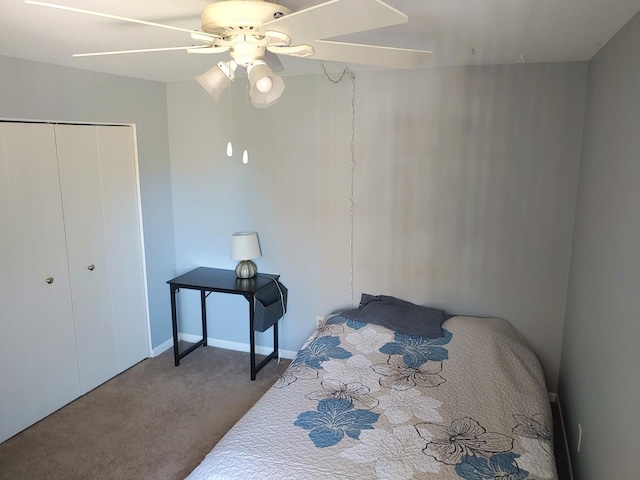 carpeted bedroom featuring a closet and ceiling fan