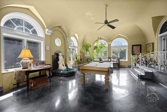 rec room with ceiling fan, pool table, and a high ceiling