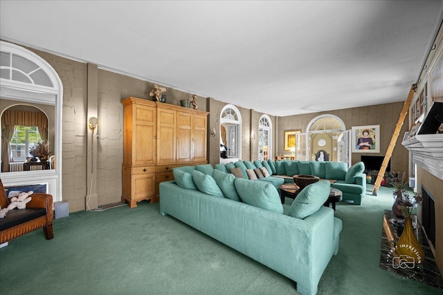 living room featuring a fireplace and light colored carpet
