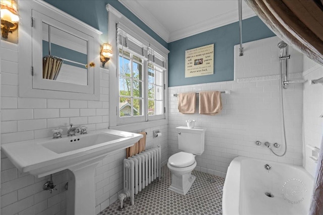 bathroom featuring radiator heating unit, tile walls, toilet, tile patterned flooring, and crown molding