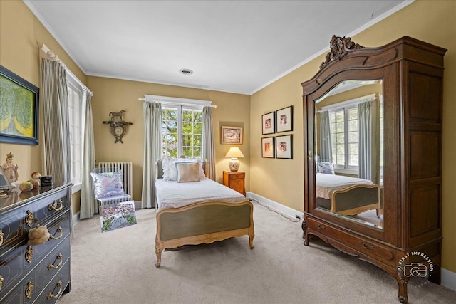 bedroom with radiator, light colored carpet, crown molding, and baseboards