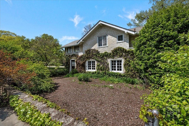 view of front of property featuring stone siding