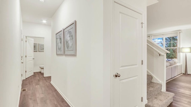 260 Snowdrop Ln, Elgin, IL 60124 - hall featuring baseboards, visible vents, wood finished floors, and stairway