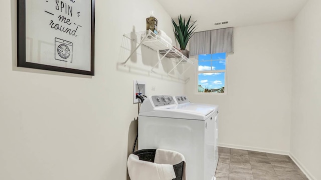 260 Snowdrop Ln, Elgin, IL 60124 - laundry room with washer and dryer, visible vents, laundry area, and baseboards