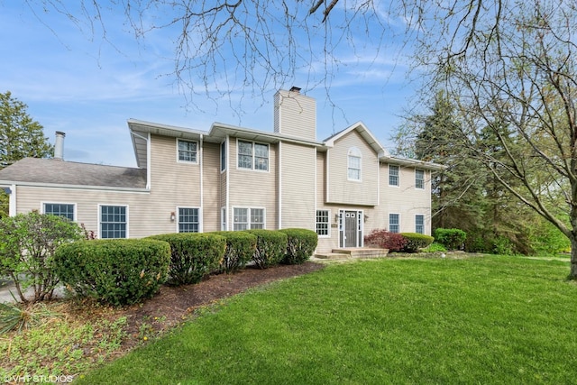 12521 S Harold Ave, Palos Heights, IL 60463 - rear view of house featuring a chimney and a lawn