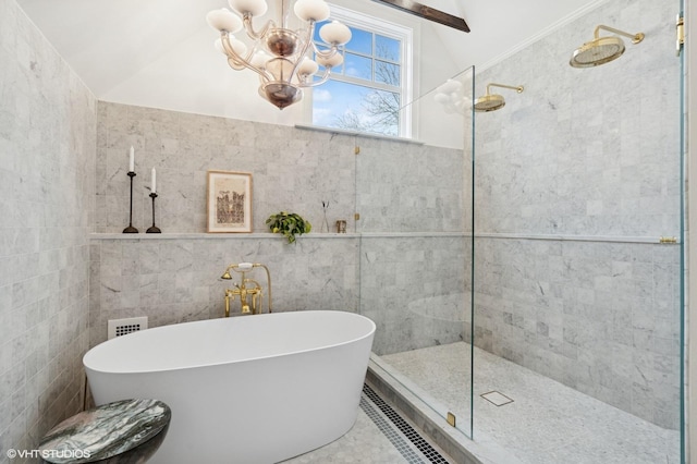 full bathroom featuring tile walls, a notable chandelier, a walk in shower, a soaking tub, and lofted ceiling