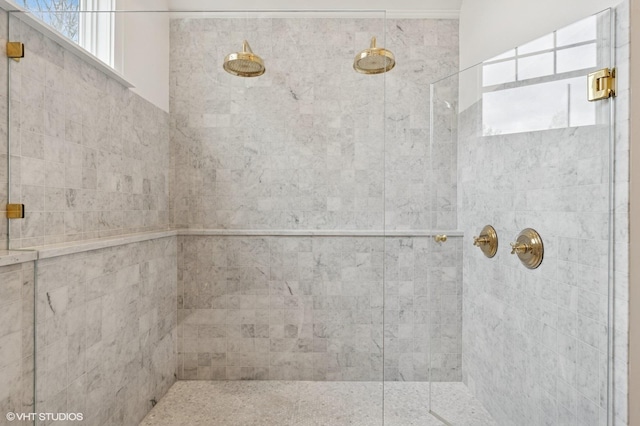 bathroom with a tile shower