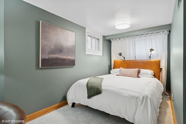 bedroom featuring baseboards