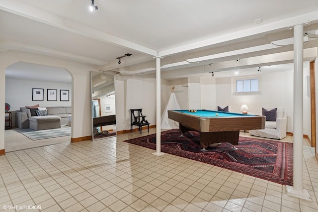 playroom with light tile patterned floors, arched walkways, beam ceiling, rail lighting, and billiards