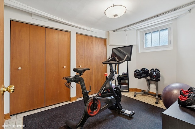 exercise room with baseboards