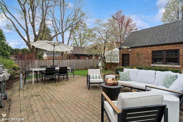 view of patio / terrace with outdoor lounge area, outdoor dining space, and a fenced backyard