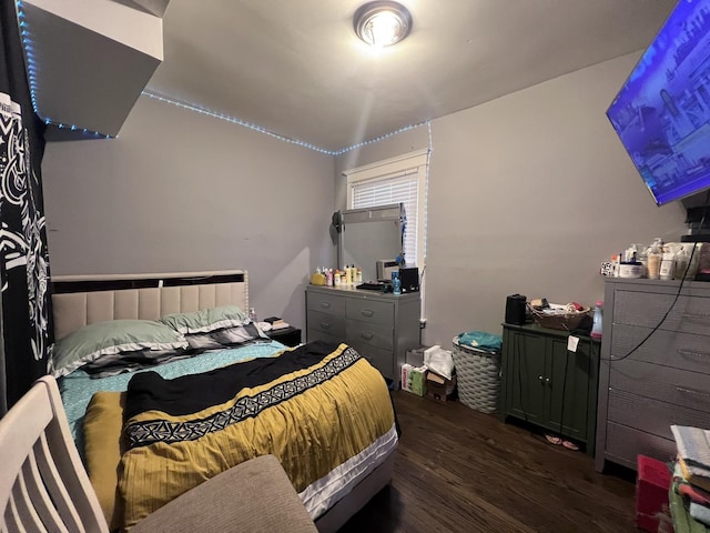 bedroom with wood finished floors