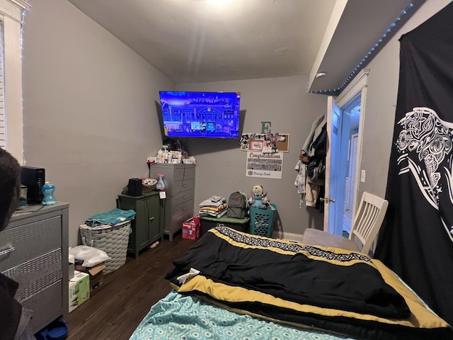 bedroom with wood finished floors