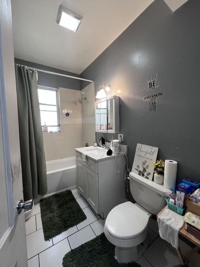 full bath featuring vanity, tile patterned floors, toilet, and shower / tub combo