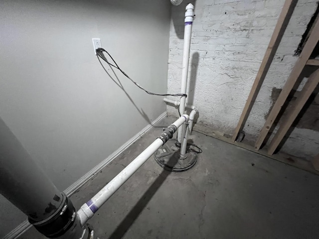 details featuring unfinished concrete flooring