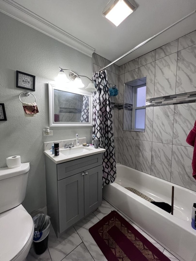 bathroom with shower / tub combo, vanity, toilet, marble finish floor, and ornamental molding