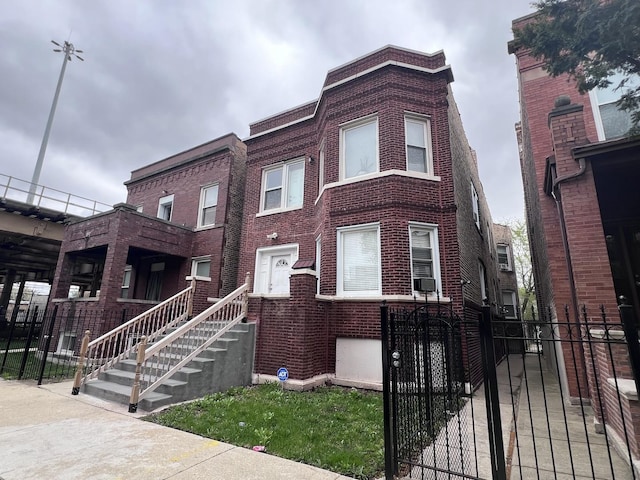 view of building exterior with cooling unit and fence private yard