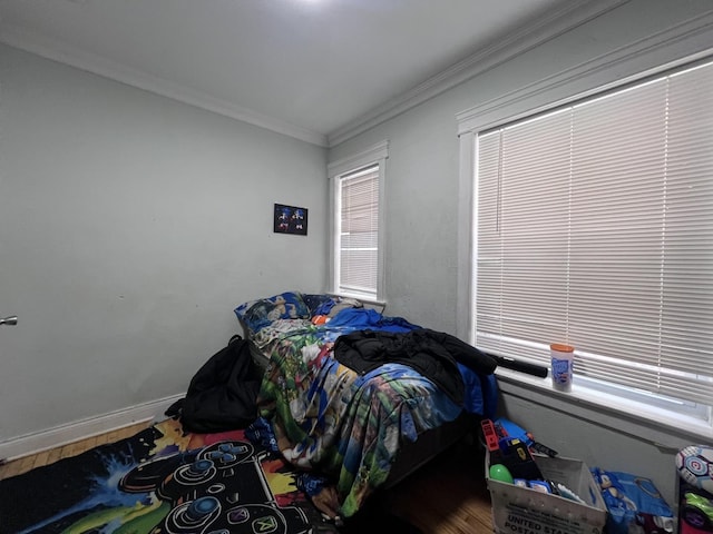 bedroom featuring crown molding