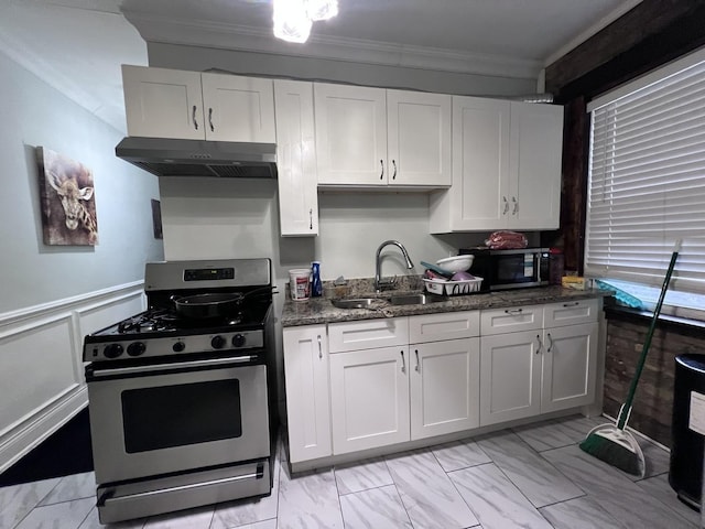 kitchen featuring a sink, stainless steel appliances, white cabinetry, under cabinet range hood, and ornamental molding