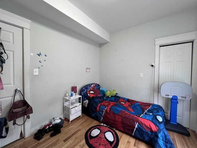 bedroom featuring wood finished floors
