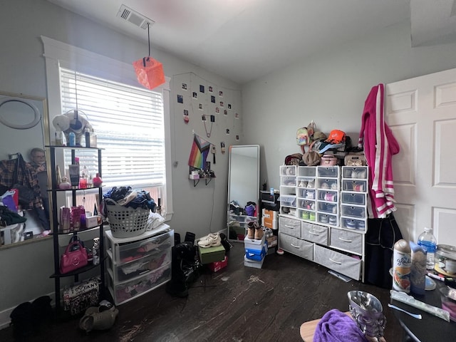 bedroom with visible vents and wood finished floors