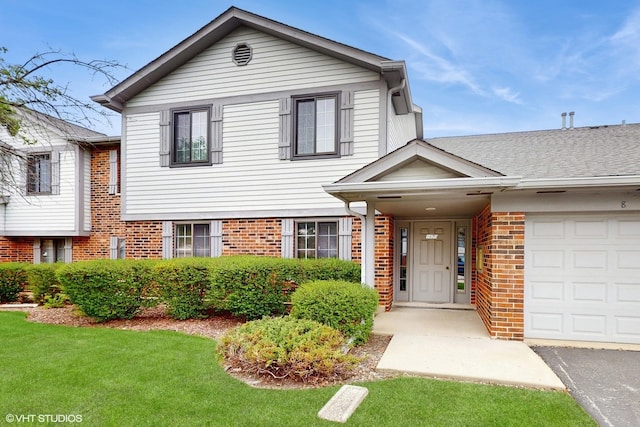1670 W Partridge Ln Unit 5, Arlington Heights, IL 60004 - split level home with a garage, a front yard, and brick siding