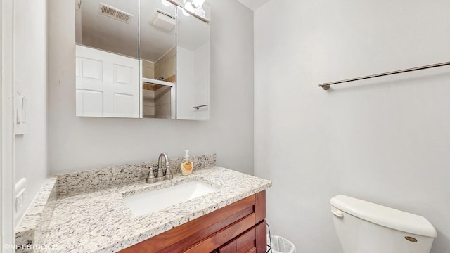 1670 W Partridge Ln Unit 5, Arlington Heights, IL 60004 - bathroom featuring toilet, a shower with door, visible vents, and vanity