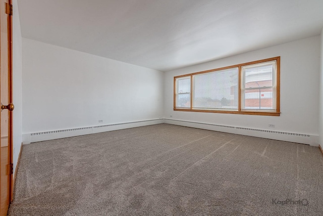carpeted empty room with baseboards and a baseboard radiator