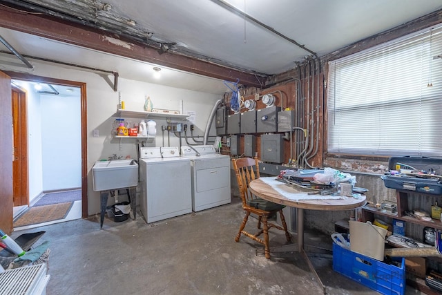 basement featuring a workshop area and washer and clothes dryer