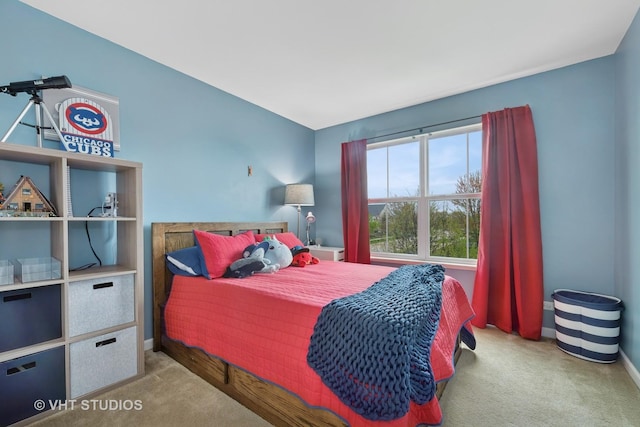 carpeted bedroom featuring baseboards