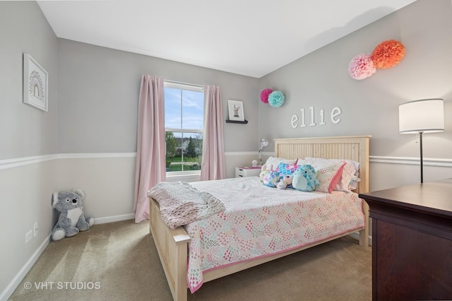 bedroom with carpet floors and baseboards
