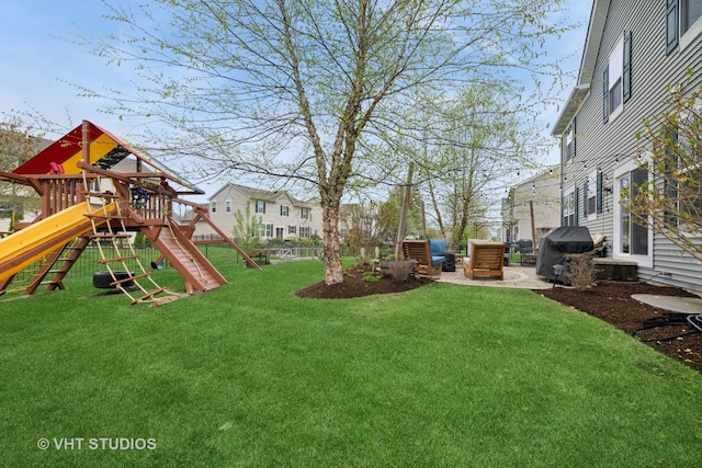 view of yard with a playground and fence
