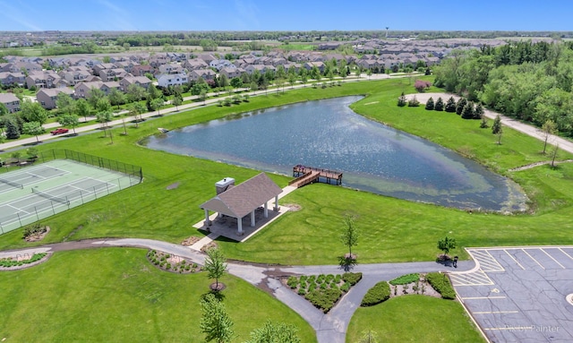 drone / aerial view featuring a residential view and a water view