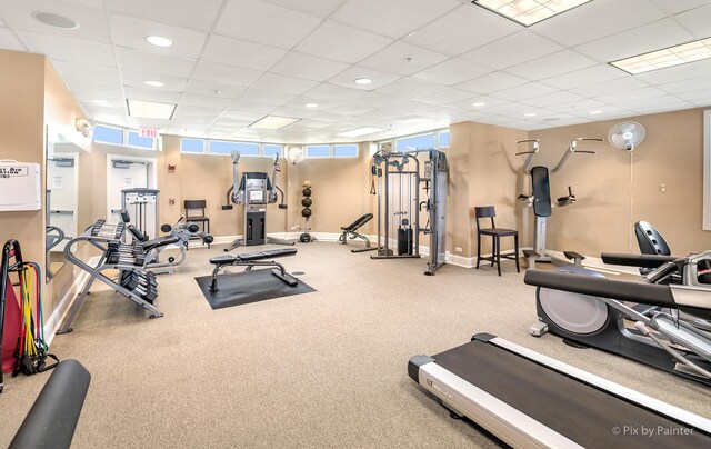 workout area with baseboards, recessed lighting, and a paneled ceiling